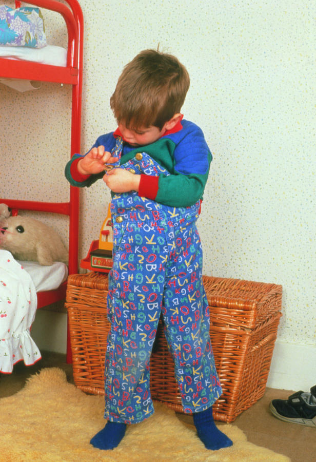 Child Photograph - Young Child Adjusting His Dungarees by Ron Sutherland/science Photo Library