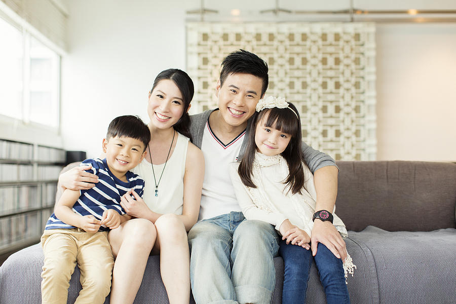 Young Chinese Family in Apartment Photograph by RichVintage