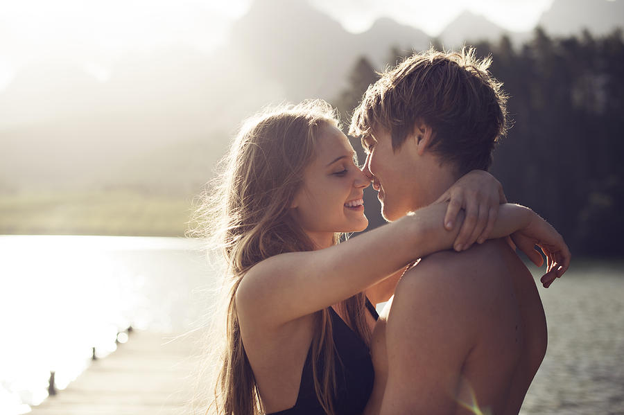 Young couple about to kiss in a natural environmen Photograph by Devon Strong