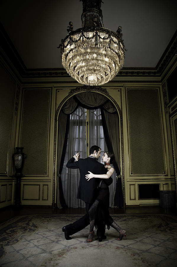 Young Couple Dancing Tango in Elegant Room Photograph by Terrababy