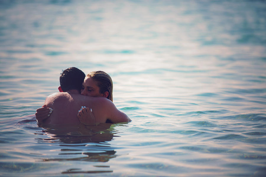 Young couple in water Photograph by Milos-kreckovic