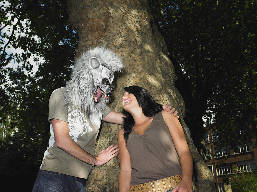 Young Couple Playing With Halloween Mask Photograph by Image Source Young Couple Playing With Halloween Mask Photograph by Image Source