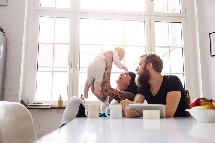 Young Family With Newborn Baby Photograph by Hinterhaus Productions