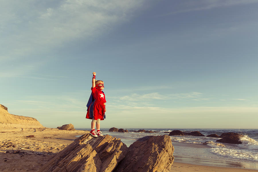Young Girl dressed as Superhero on California Beach Photograph by RichVintage
