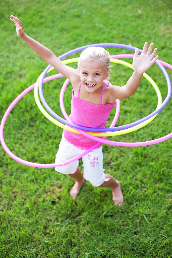 Child Photograph - Young Girl Hula-hooping by Ian Hooton/science Photo Library