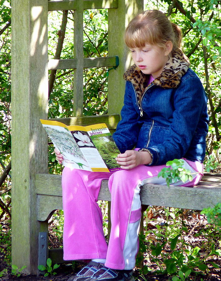 Young Girl Reading In The Garden Photograph by Jeff Lowe
