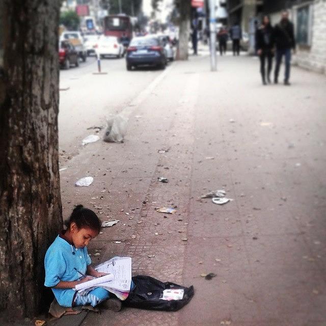 Life Photograph - #young #girl #studing #while #selling by Hema Ezzat