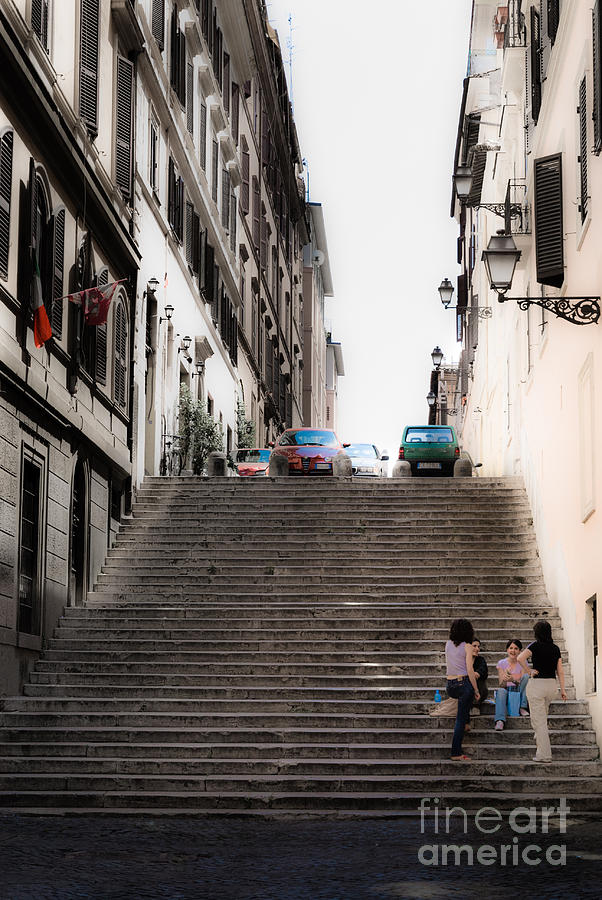 young girls sat on the steps chatting off the Via Cavour Rome It Photograph by Peter Noyce