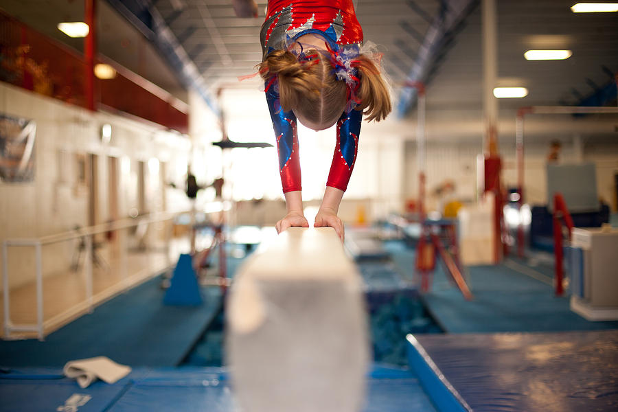 Young Gymnast Doing Handstand on Balance Beam Photograph by Ssj414