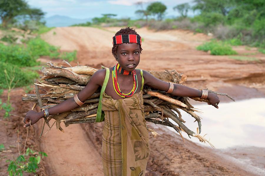 Young Hamar Girl Collecting Fire Wood Photograph by Tony Camacho