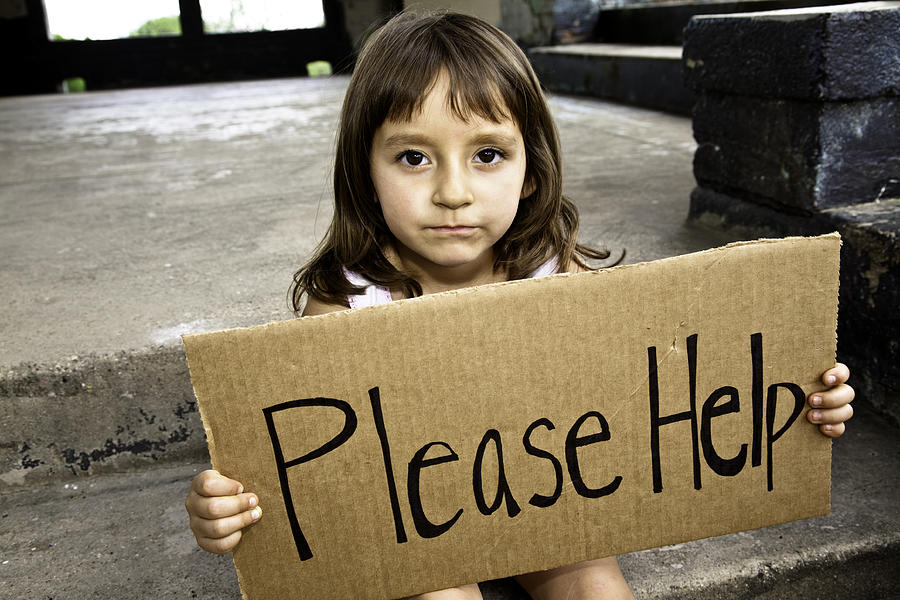 Young Hispanic Girl Holding a Please Help Sign Photograph by Steve Debenport