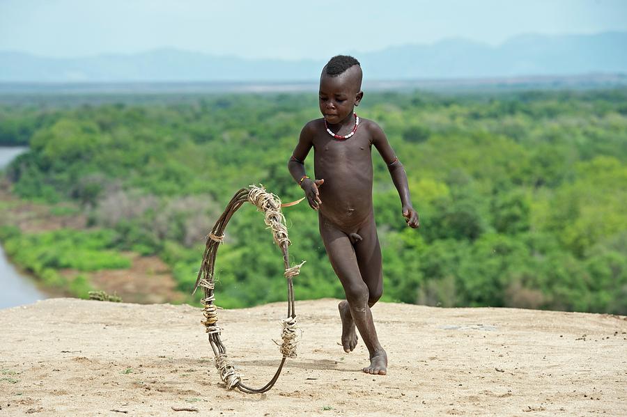 Nude Photograph - Young Karo Boy With Home Made Toy Hoop by Tony Camacho