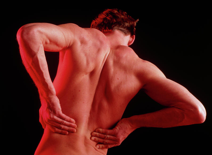 Young Man Affected By Back Pain Doing Self Massage Photograph By Seth Joel Science Photo Library