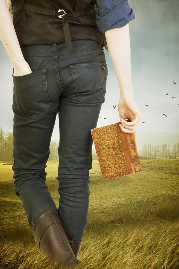 Young Man Walking Through A Meadow Holding A Book Photograph by Ethiriel Photography