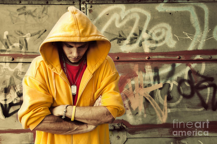Cool Photograph - Young man in hooded sweatshirt on grunge wall by Michal Bednarek