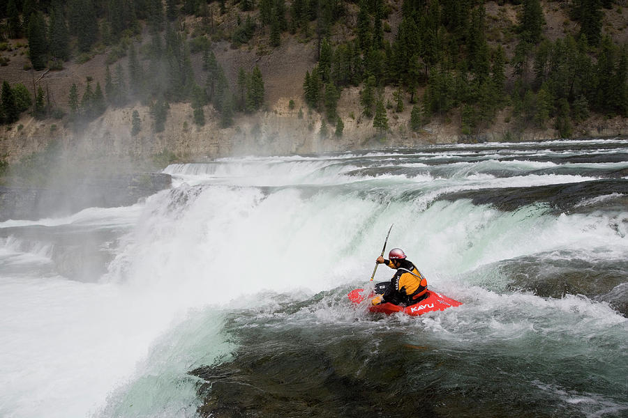 Sports Photograph - Young Man Kayaking Over Kootenai Falls by Henry Georgi