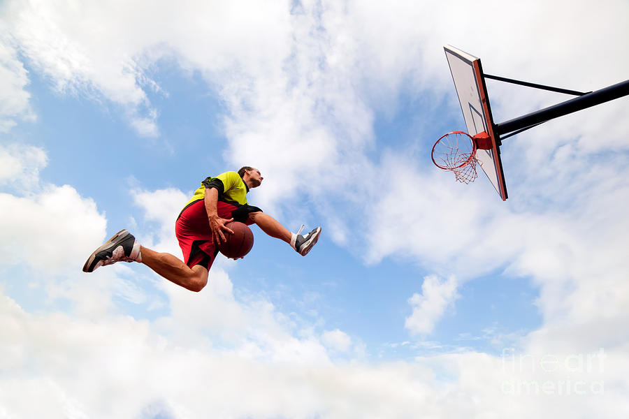Young Man Making A Fantastic Slam Dunk Playing Streetball Basketball Photograph