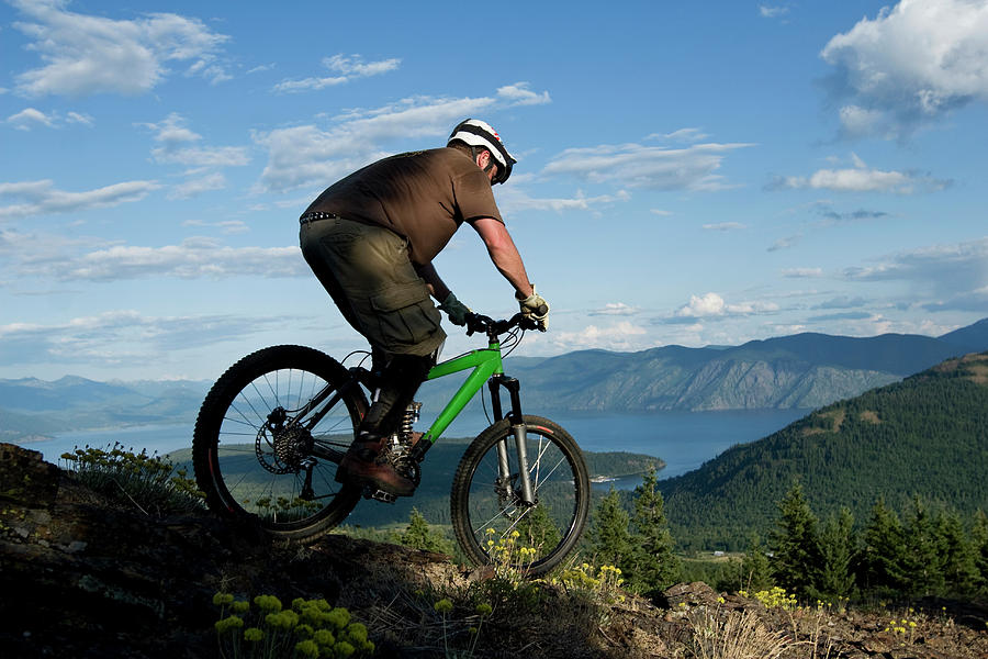 20s Photograph - Young Man Mountain Biking With Lake by Patrick Orton 20s Photograph - Young Man Mountain Biking With Lake by Patrick Orton