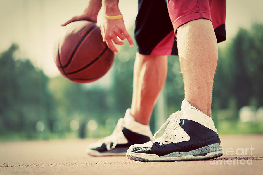 Young Man On Basketball Court Dribbling With Bal Photograph