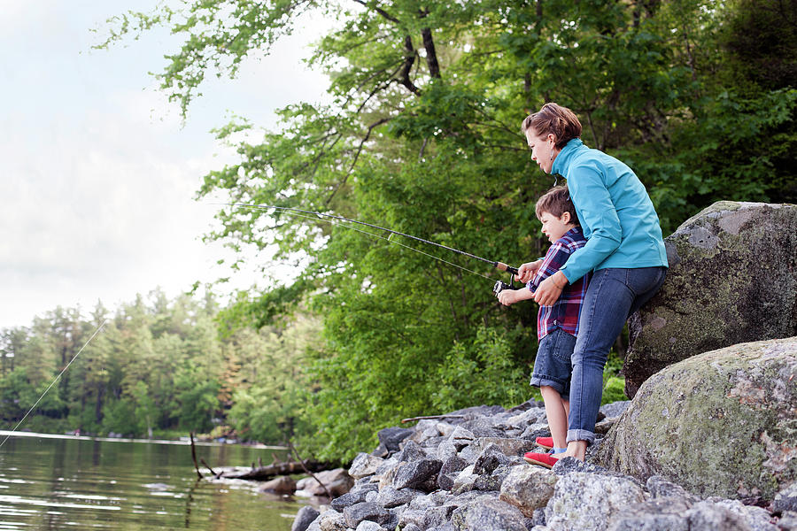 Young Mother Helping Son Fish At Kezar Photograph by Monica Donovan ...