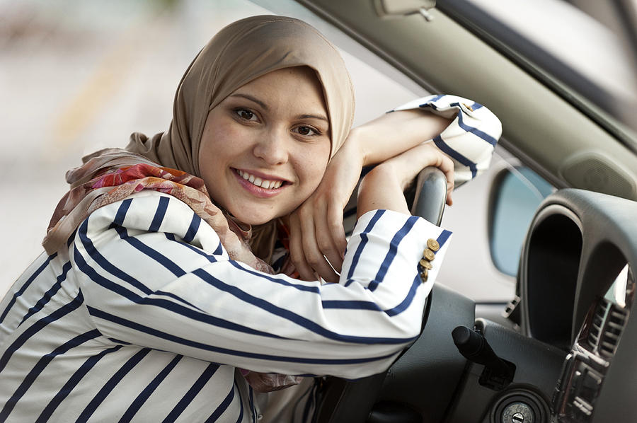 Young muslim female driver Photograph by Juanmonino