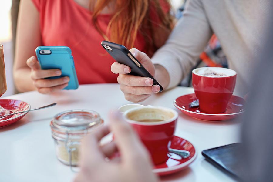 Young People In Cafe Using Smartphones Photograph by Science Photo Library Young People In Cafe Using Smartphones Photograph by Science Photo Library