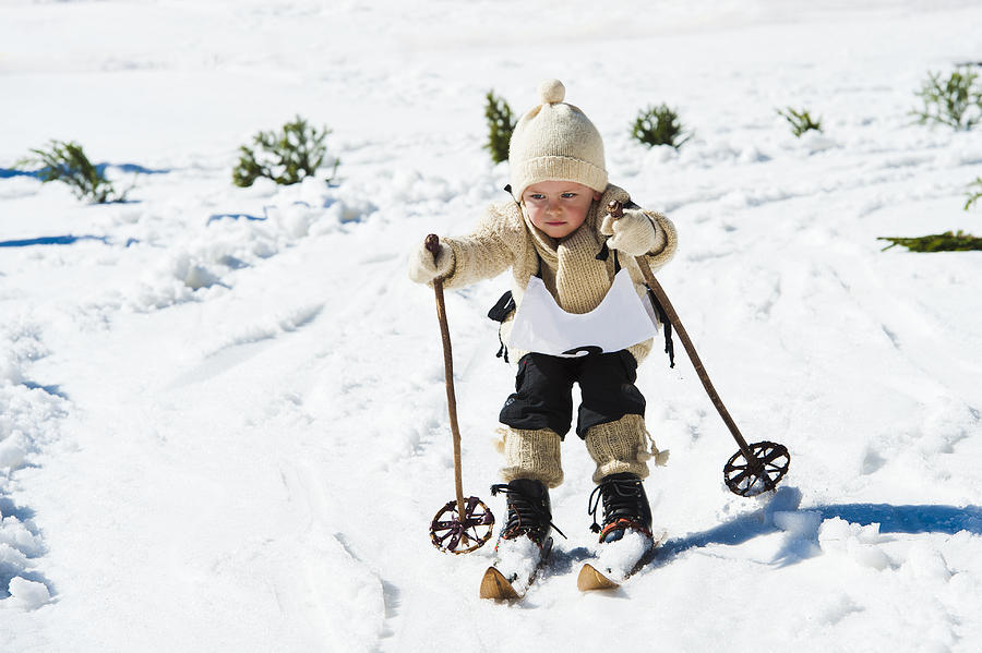 Young skier using retro ski equipment Photograph by Technotr