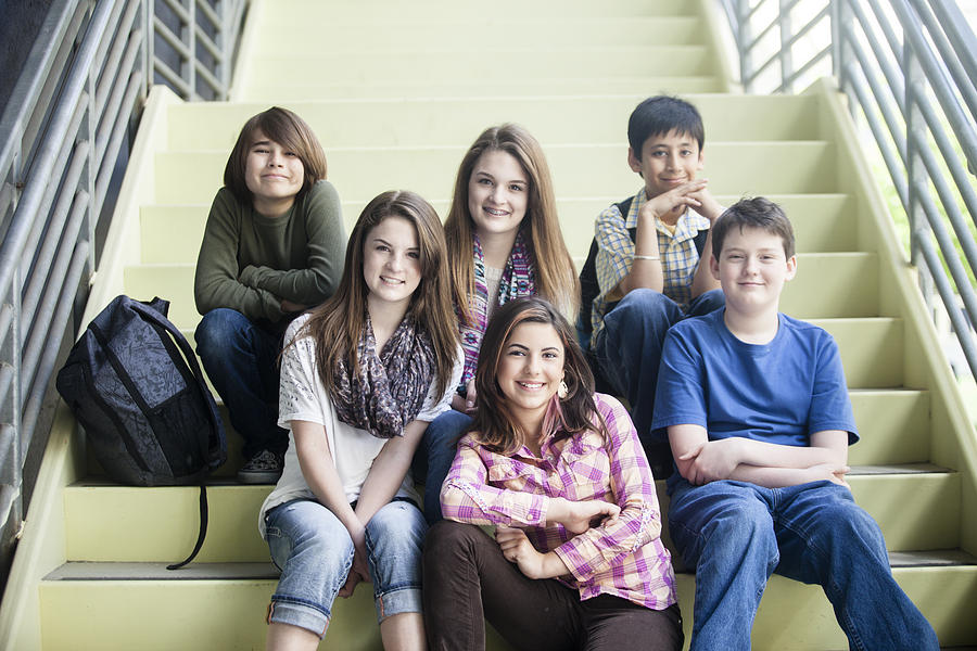Young Students Sitting Together on Staircase Photograph by Adamkaz