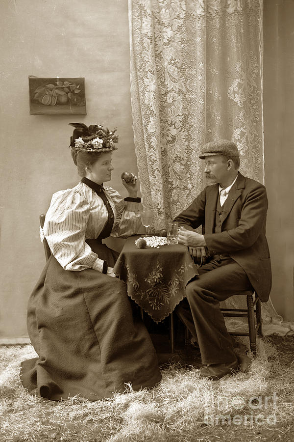 Young Photograph - Young Victorian couple sitting at a table circa 1910 by Monterey County Historical Society