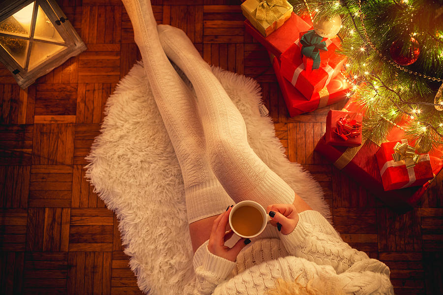 Young Woman Drinking Hot Coffee on Christmas Night Photograph by Kajakiki
