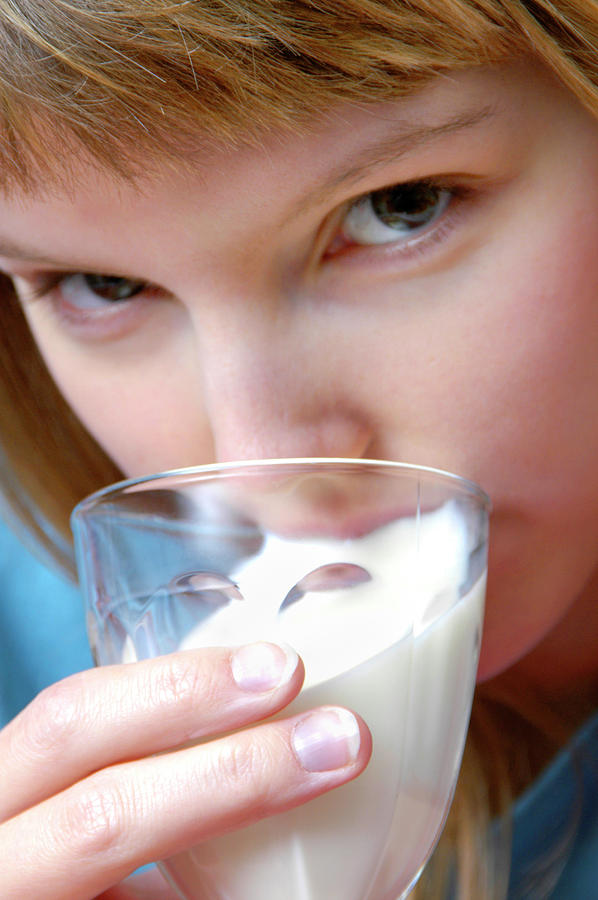 Young Woman Drinking Milk Photograph by Aj Photo/science Photo Library