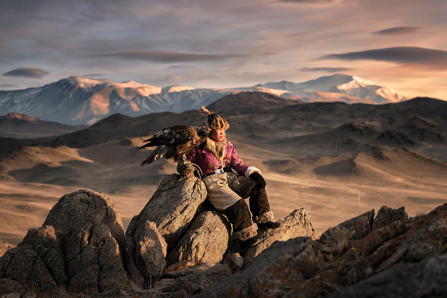 Young woman eagle hunting from the Altai moutains, Mongolia Photograph by Aumphotography