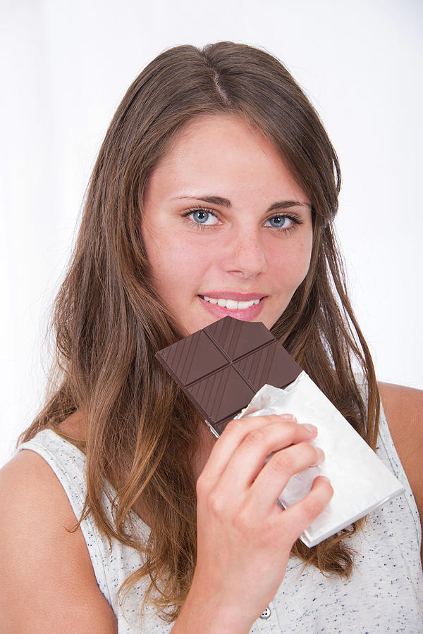 Young Woman Eating Chocolate Photograph By Lea Patersonscience Photo Library Pixels 