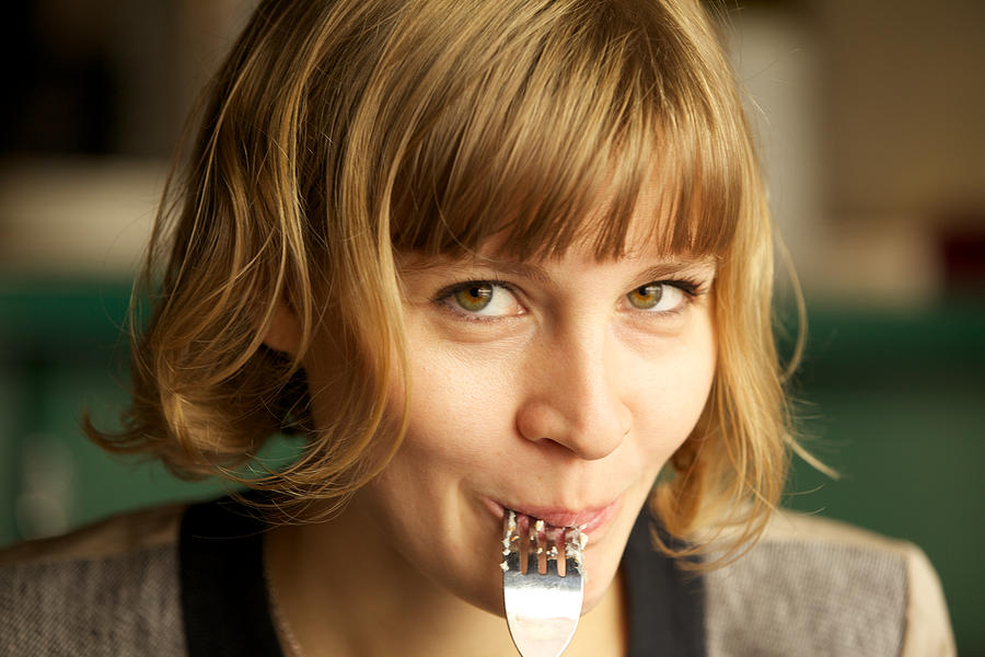 Young woman enjoying food Photograph by Aleksandr Morozov