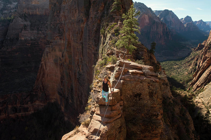 Zion National Park Photograph - Young Woman Hiking At Angels Landing by Brandon Huttenlocher