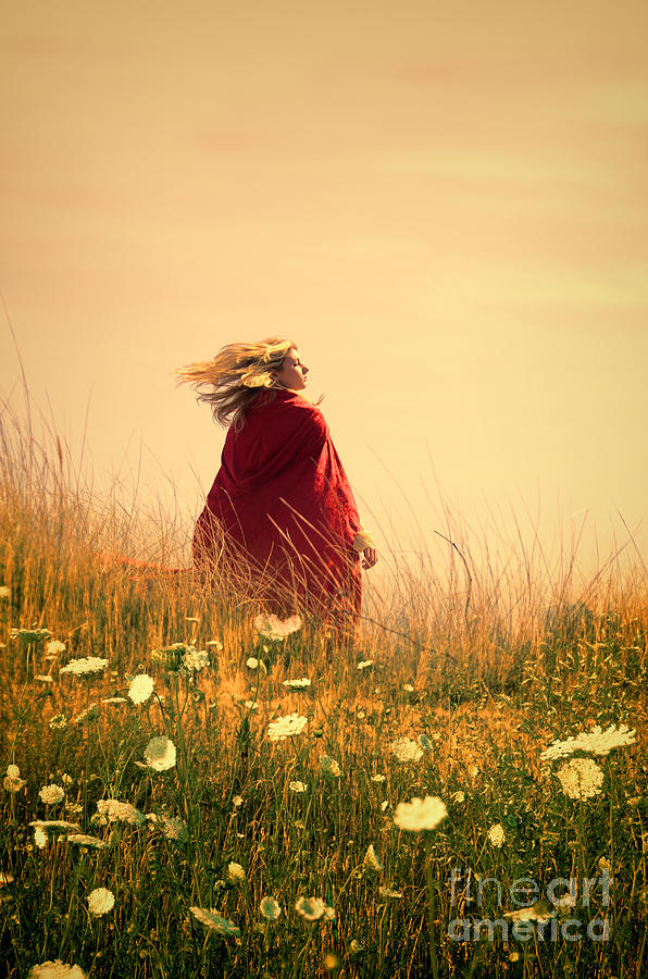 Young woman in a field. Photograph by Jill Battaglia