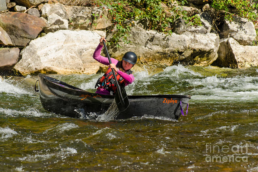 Young woman in a whitewater canoe Photograph by Les Palenik