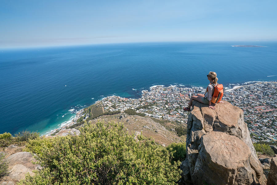 Young woman in Cape Town on top of mountain looking at view Photograph by Swissmediavision