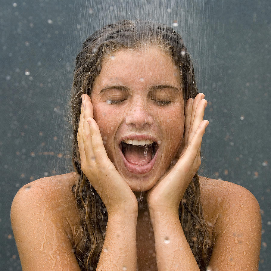 Young woman in shower Photograph by photo PATRIZIA SAVARESE