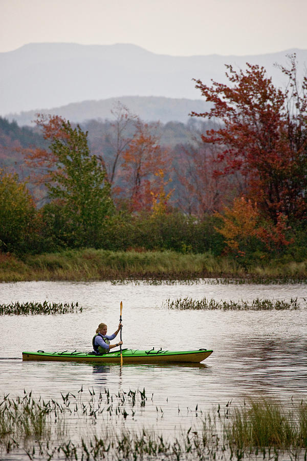 Sports Photograph - Young Woman Kayaking Near Tupper Lake by Henry Georgi