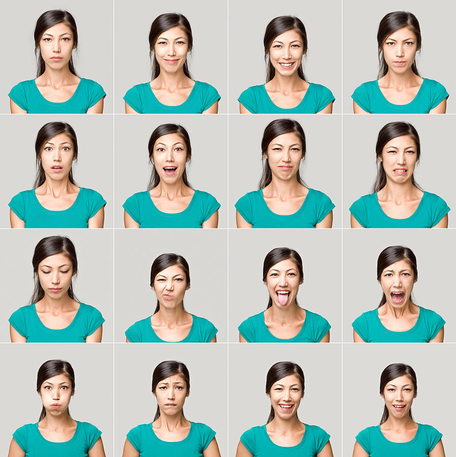 Young woman making facial expressions Photograph by Ozgurdonmaz