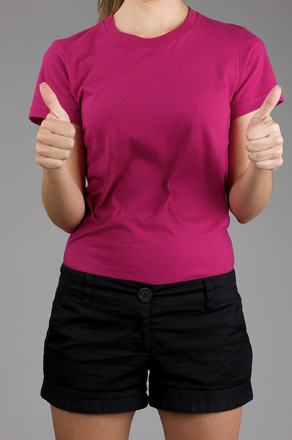 Young woman posing with blank purple shirt Photograph by Billnoll