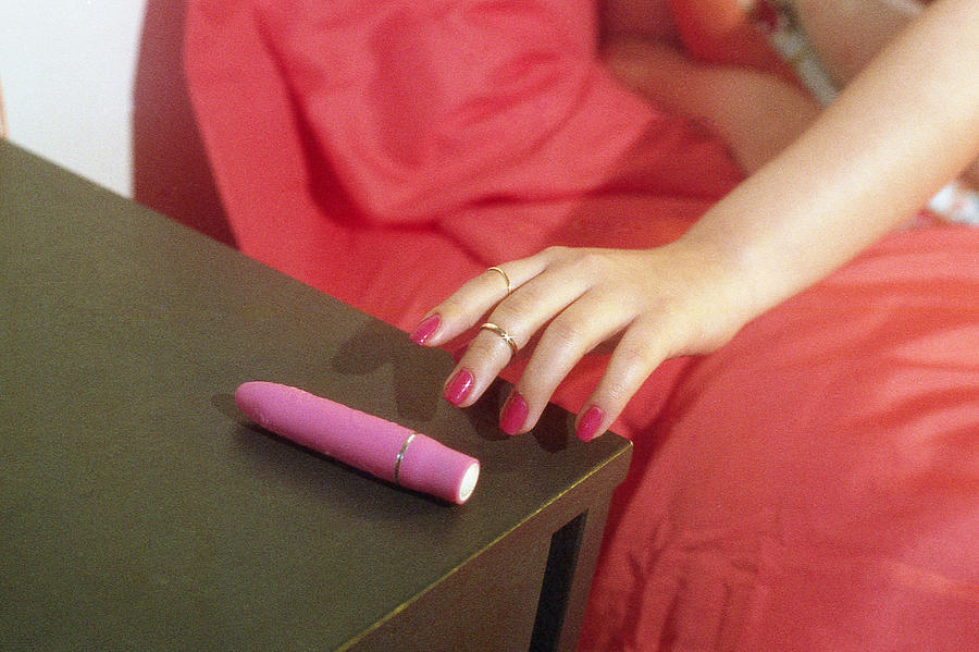 Young Woman Reaching For Vibrator Photograph by Ashley Armitage / Refinery29 for Getty Images