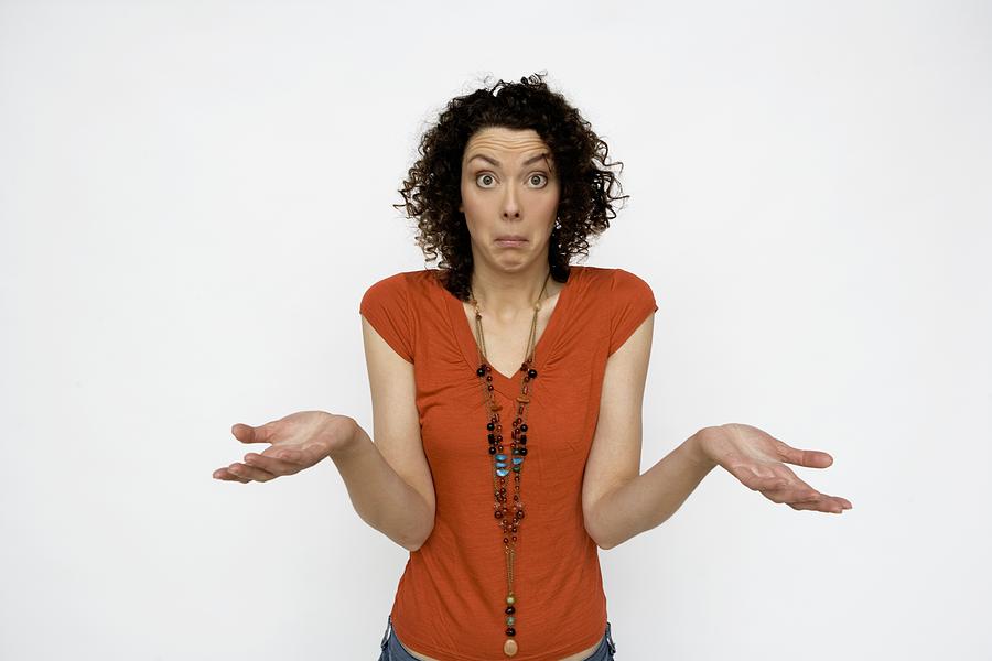 Young Woman Shrugging Photograph by Hill Creek Pictures Young Woman Shrugging Photograph by Hill Creek Pictures