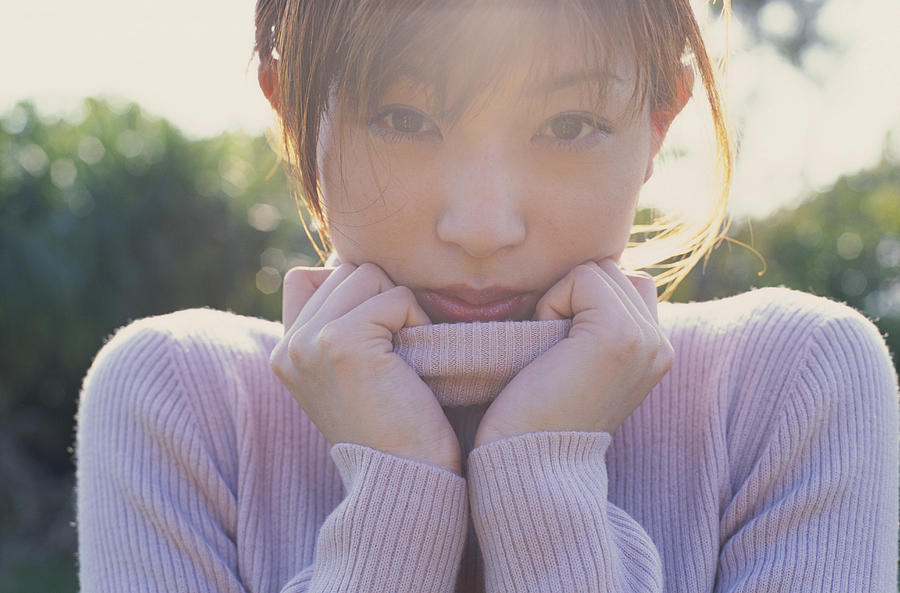 Young woman wearing turtle neck top, close-up, portrait Photograph by Ryuichi Sato
