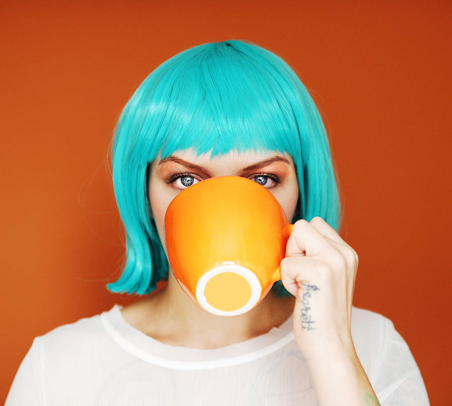 Young woman with blue hair drinking Photograph by Rekha Garton