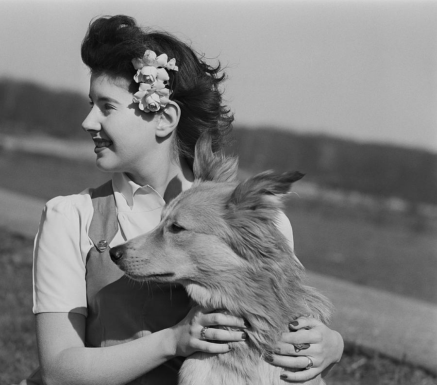 Young woman with dog outdoors Photograph by George Marks