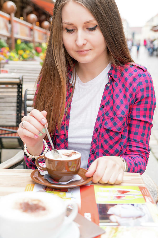 Young Woman With Hot Drink At Outdoor Cafe Photograph by Science Photo Library Young Woman With Hot Drink At Outdoor Cafe Photograph by Science Photo Library
