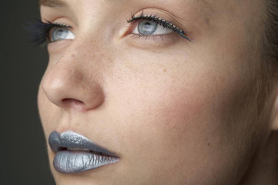 Young woman with silver colored lips (part of), close-up Photograph by Stock4b-rf