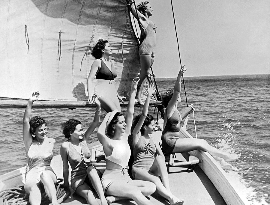 Young Women On A Sailboat. Photograph by Underwood Archives